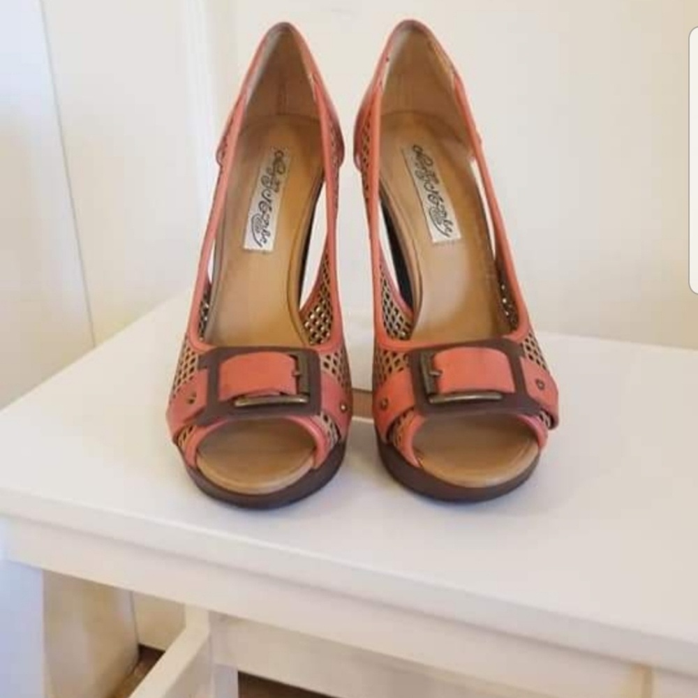 Pair of brown leather peep toe heels